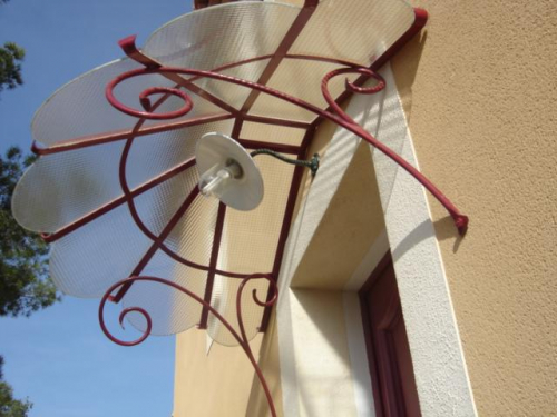 Marquise en fer forgé pour porte entrée à Marseille